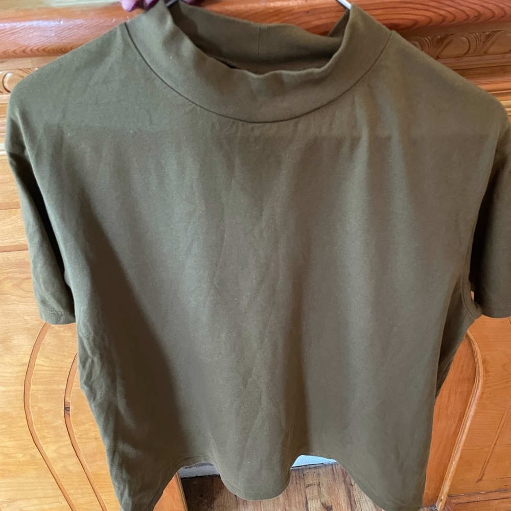 Green Uniqlo mock neck shirt.